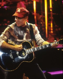Singer Paul Simon performing at a concert in Paris, France.