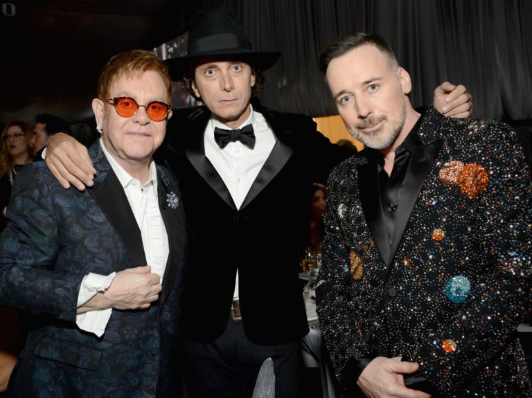 Elton John Jokes About Raising $7 Mil for AIDS at Oscar Bash: “Thank [blank] we didn’t have Warren Beatty do the auction!”