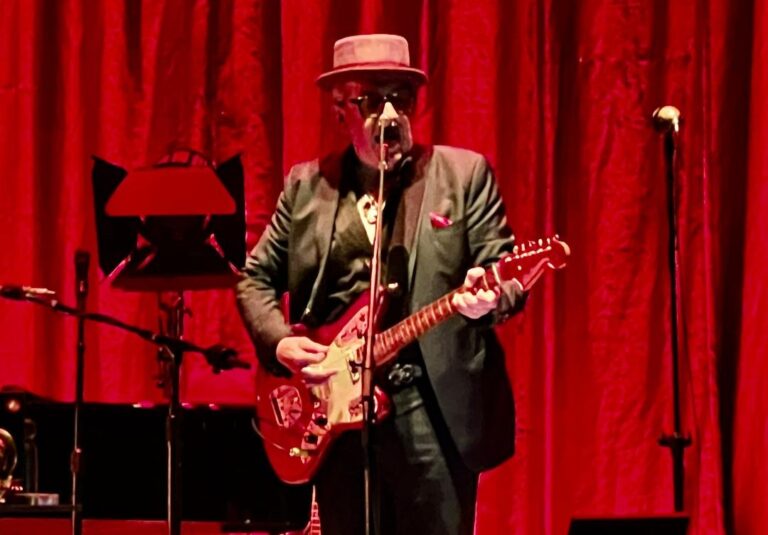 Elvis Costello Opens Extraordinary 2 Man Show Joking: “I’d like Timothee Chalamet to Play ME in a Movie!”